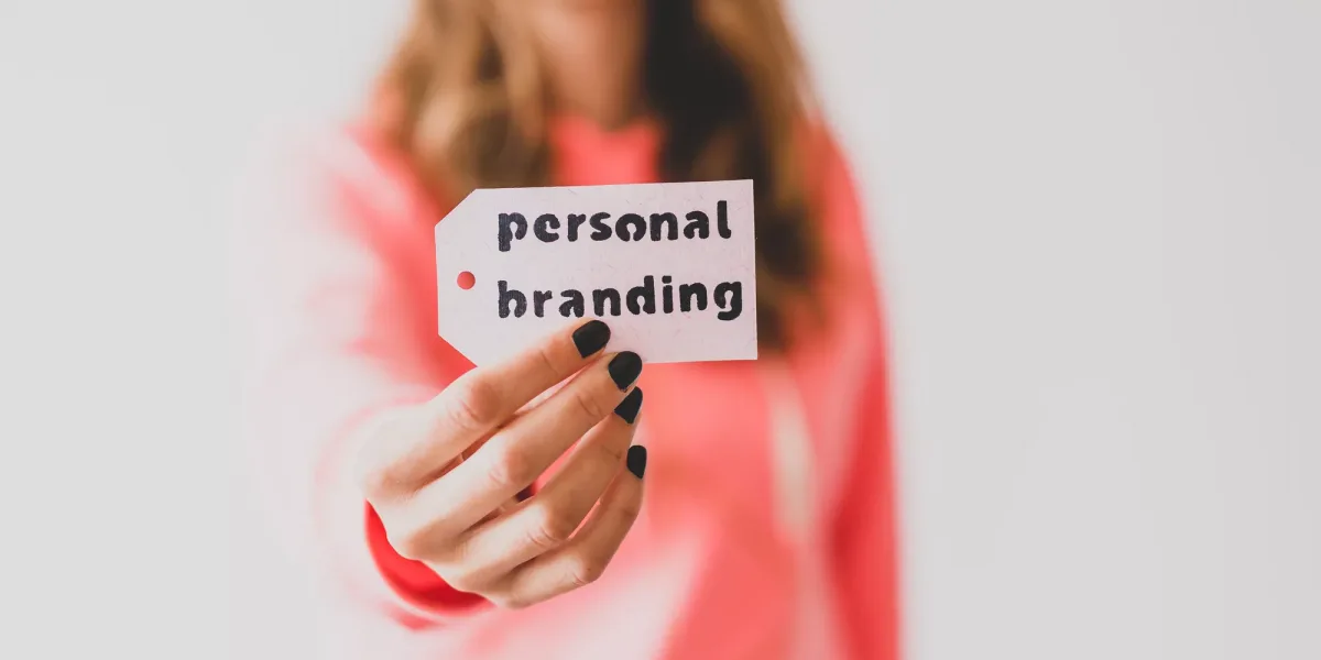 influencers and fame, girl holding Personal Branding message on